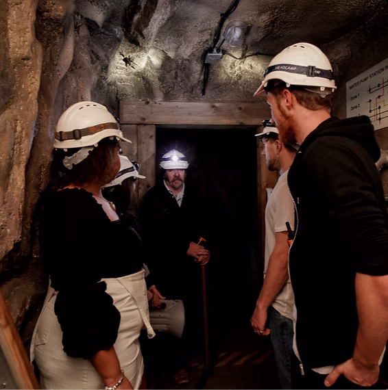 Players exploring The Pit escape room